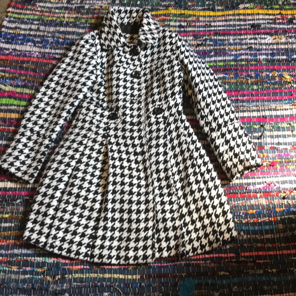 A black and and white coat